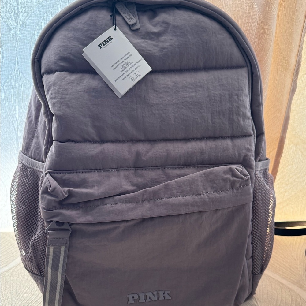 Pink Backpack with Mesh Pockets
Light purple